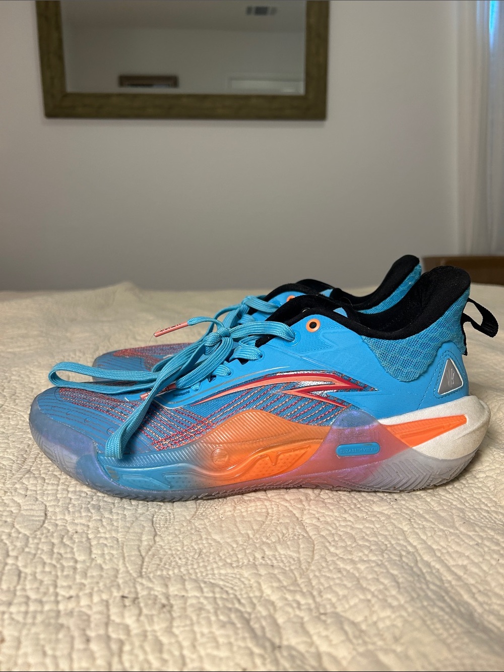Men’s ANTA Athletic Shoes in Turquoise with Orange Accents